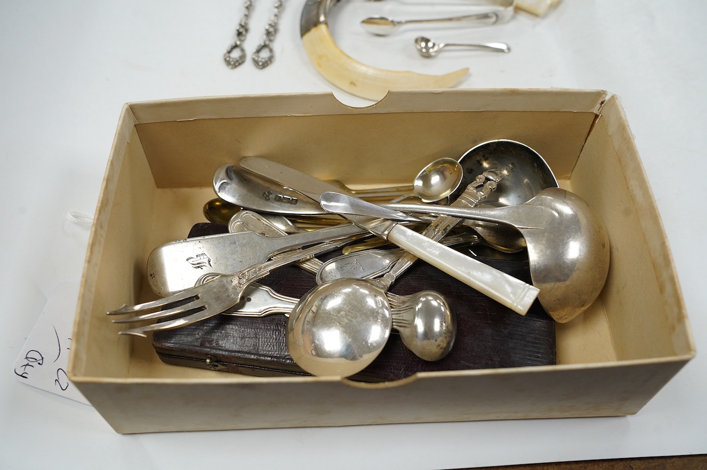 A 19th century white metal mounted tusk vinaigrette? (lacking grille), 11cm and a small quantity of 19th century and later silver cutlery, 10.4oz, including a cased christening trio and a Georg Jensen spoon and a box. Co